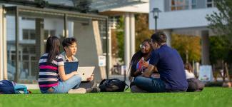 Students sitting in a circle outside at the UBC campus. Photo credit: Paul H. Joseph / UBC Brand & Marketing